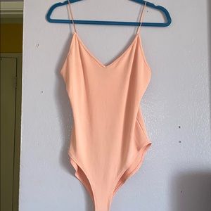 Never worn ! Bodysuit